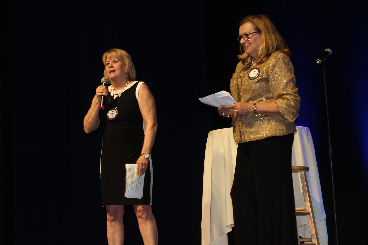 Janeene Hart and Cyndi King of the Rotary Club of Ponte Vedra Beach Sunset address the crowd at the Comedy for a Cause fundraiser.